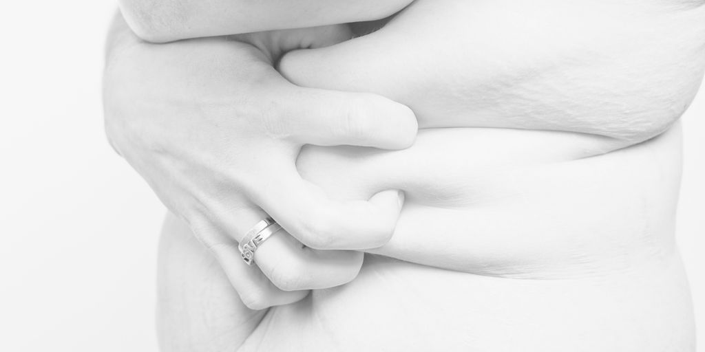 grayscale photo of woman wearing ring