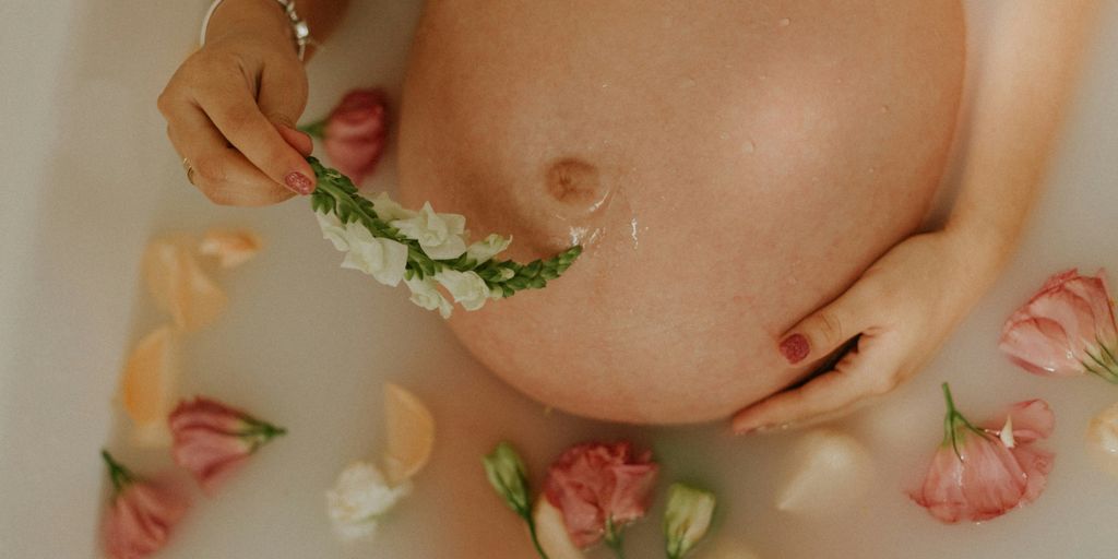 woman with pink and white flowers on her breast